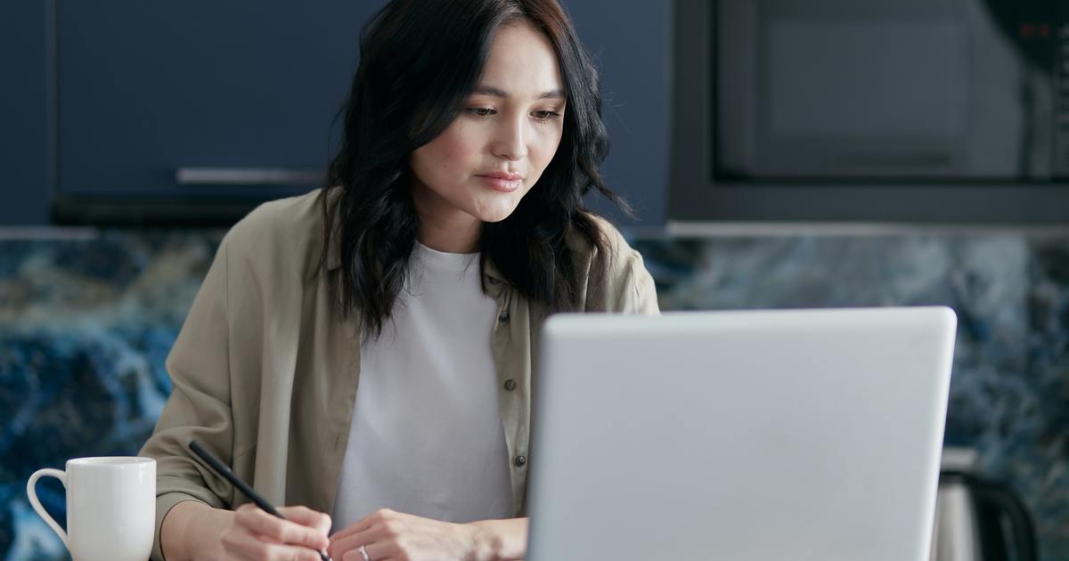 Writer watching a virtual event and taking notes
